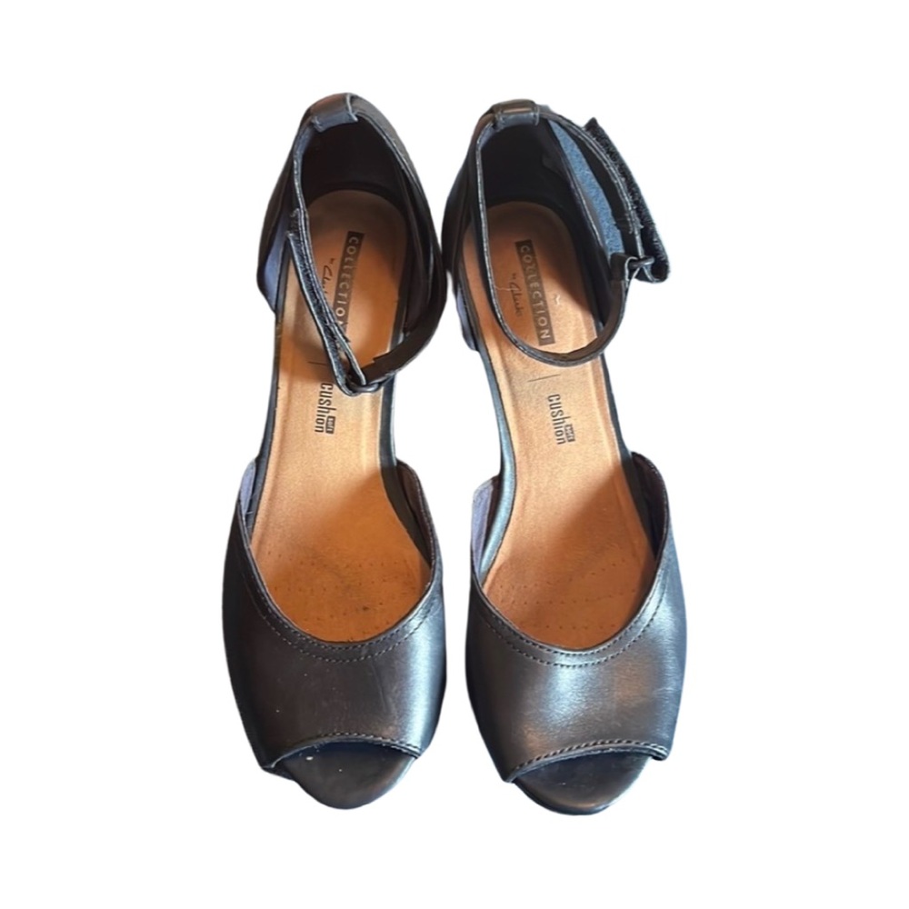 Navy blue Clarks wedge peek toe with ankle strap. Size 8.